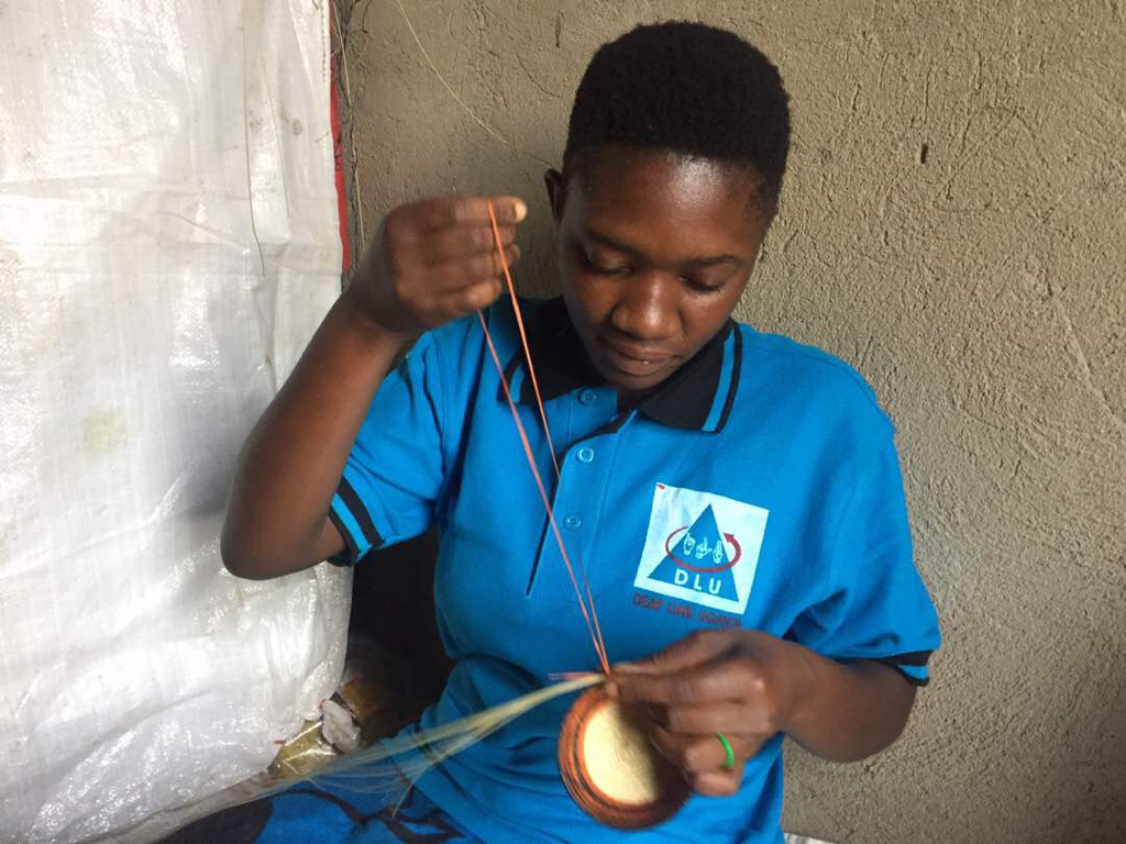 Deaf-girl-in-Fort-Portal-with-delicat-crafts-2