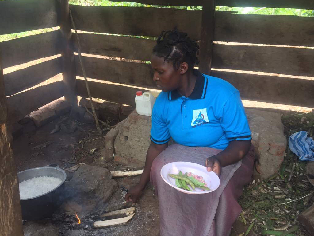 Lady-coocking-food-in-Fort-Portal