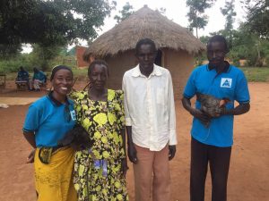 Olupot with his parents at their home.